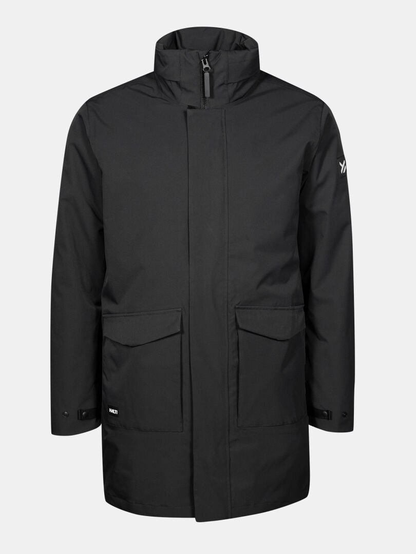 Halti Synkas II 3in1 DX Parka Miesten: musta polvipituinen takki, jossa on vetoketju edessä, korkea kaulus ja kaksi etutaskua.