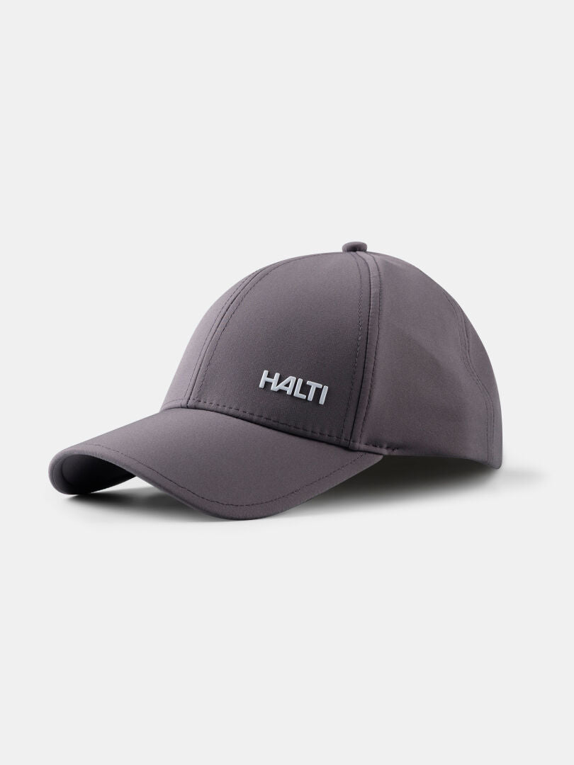 Harmaa Halti Mattas Baseball-lippis, jossa on UPF 50+ ja kaareva reunus, kuvassa valkoisella pohjalla.