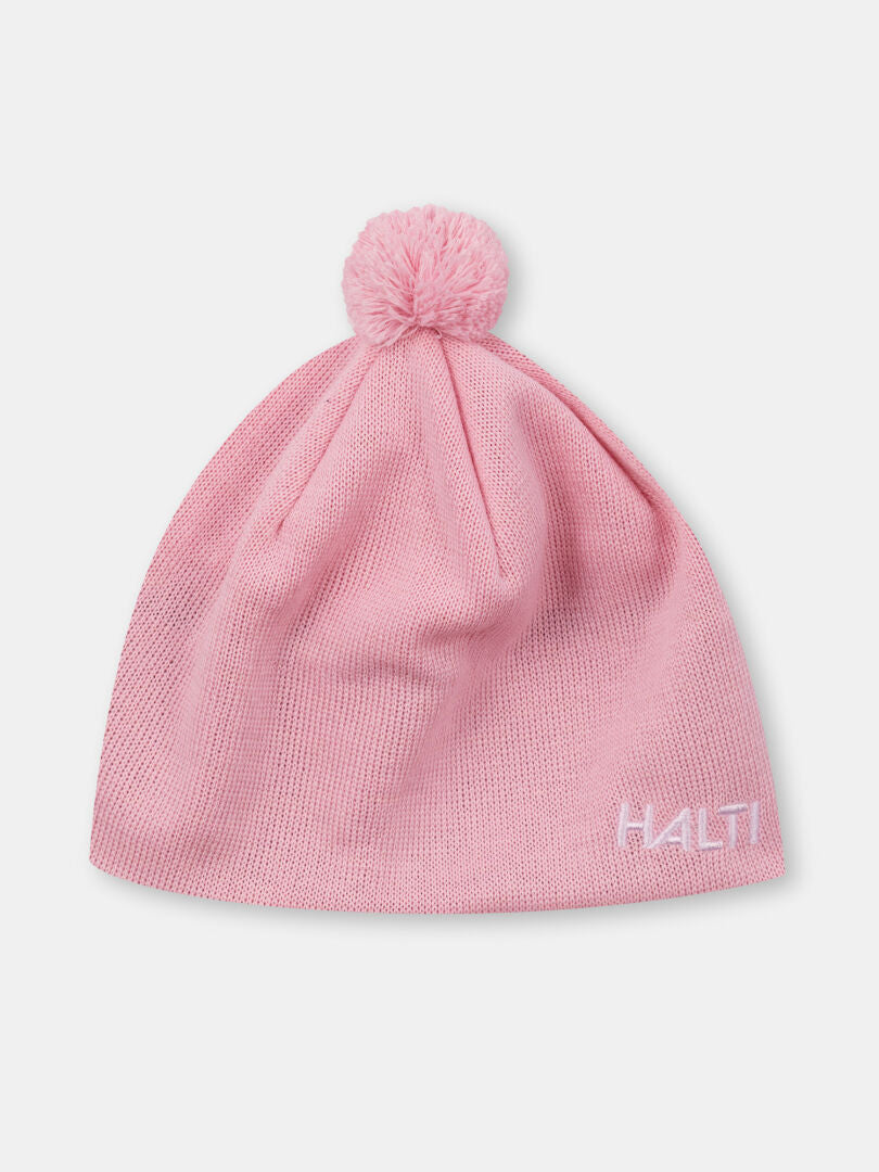 Vaaleanpunainen Peesi II Pipo merinovillapipo Haltilta, jonka etupuolella on pompsut ja valkoinen HALTI-kirjonta.