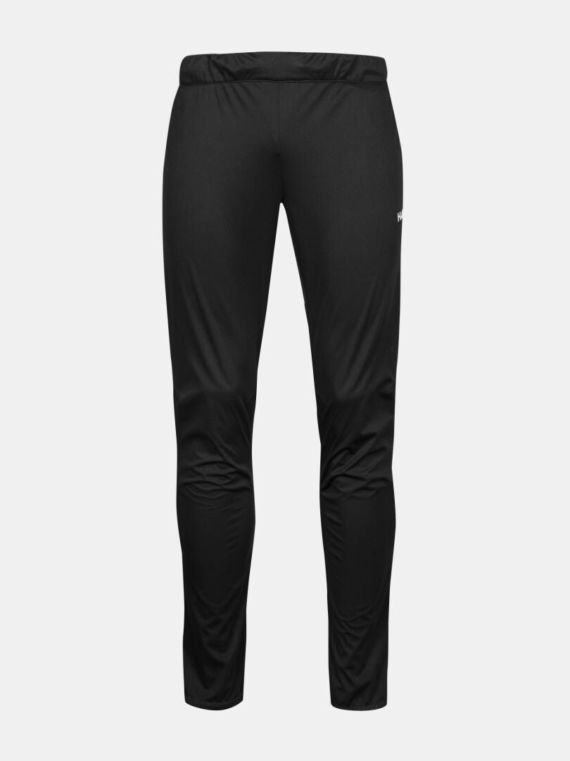 Halti Framover Hiihtohousut Miesten: mustat slim fit -treenihousut, joissa on joustava vyötärö ja valkoinen logo vasemmassa reidessä.