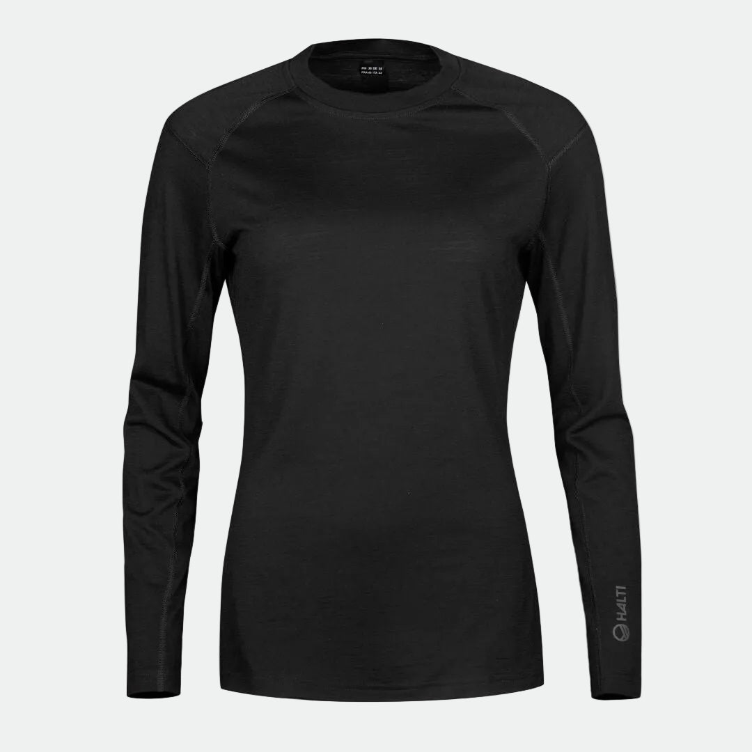 Halti Pihka II Merino Aluspaita Naisten, yksivärinen musta, jossa pieni logo vasemmassa hihassa, kuvassa valkoisella taustalla.