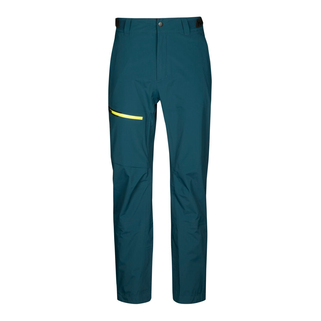 Halti Alpine 3L DX Kuorihousut Miesten-teal hiihtohousut, joissa on etunappi, vetoketju ja keltainen vetoketjullinen sivutasku.