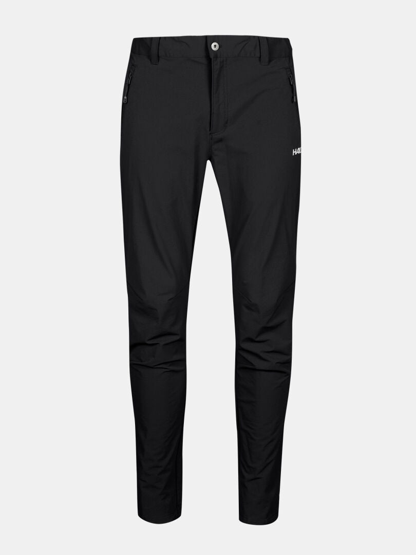 Halti Finholma X-stretch Housut Miesten: mustat slim fit -housut vetoketjulla, sivutaskuilla ja valkoisella logolla vasemmassa reidessä.